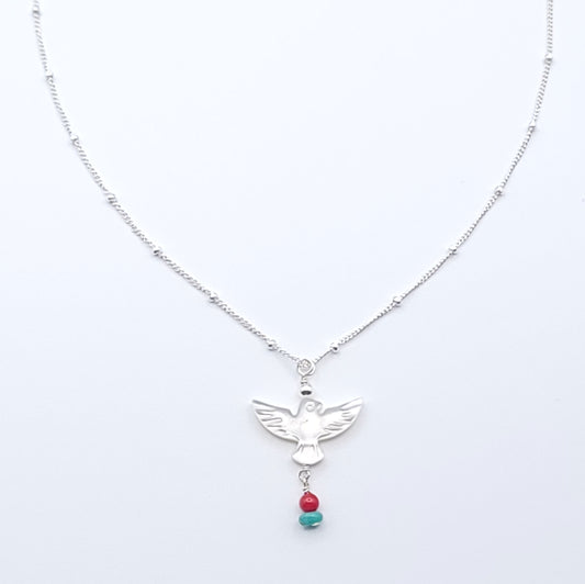 Wings of Hope Necklace featuring a mother-of-pearl bird pendant accented with turquoise and coral on an 16-inch sterling silver satellite chain.