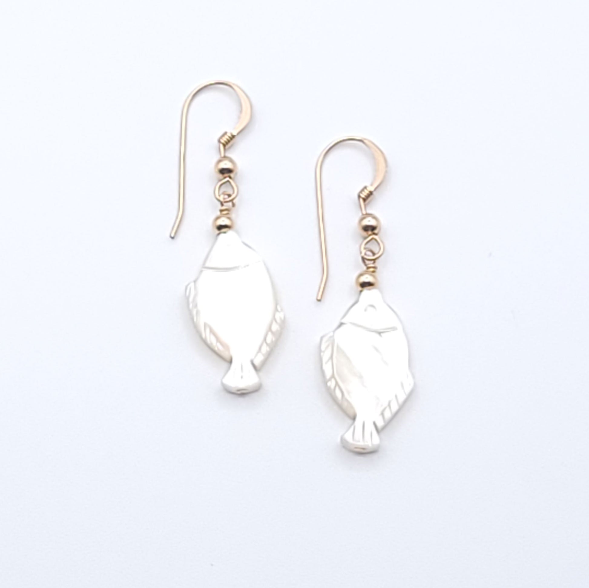 Lucky Fish Earrings featuring genuine mother-of-pearl fish with gold-filled ear wires.