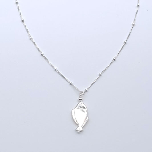 Lucky Fish Necklace featuring a natural mother-of-pearl fish pendant on an 16-inch sterling silver satellite chain.